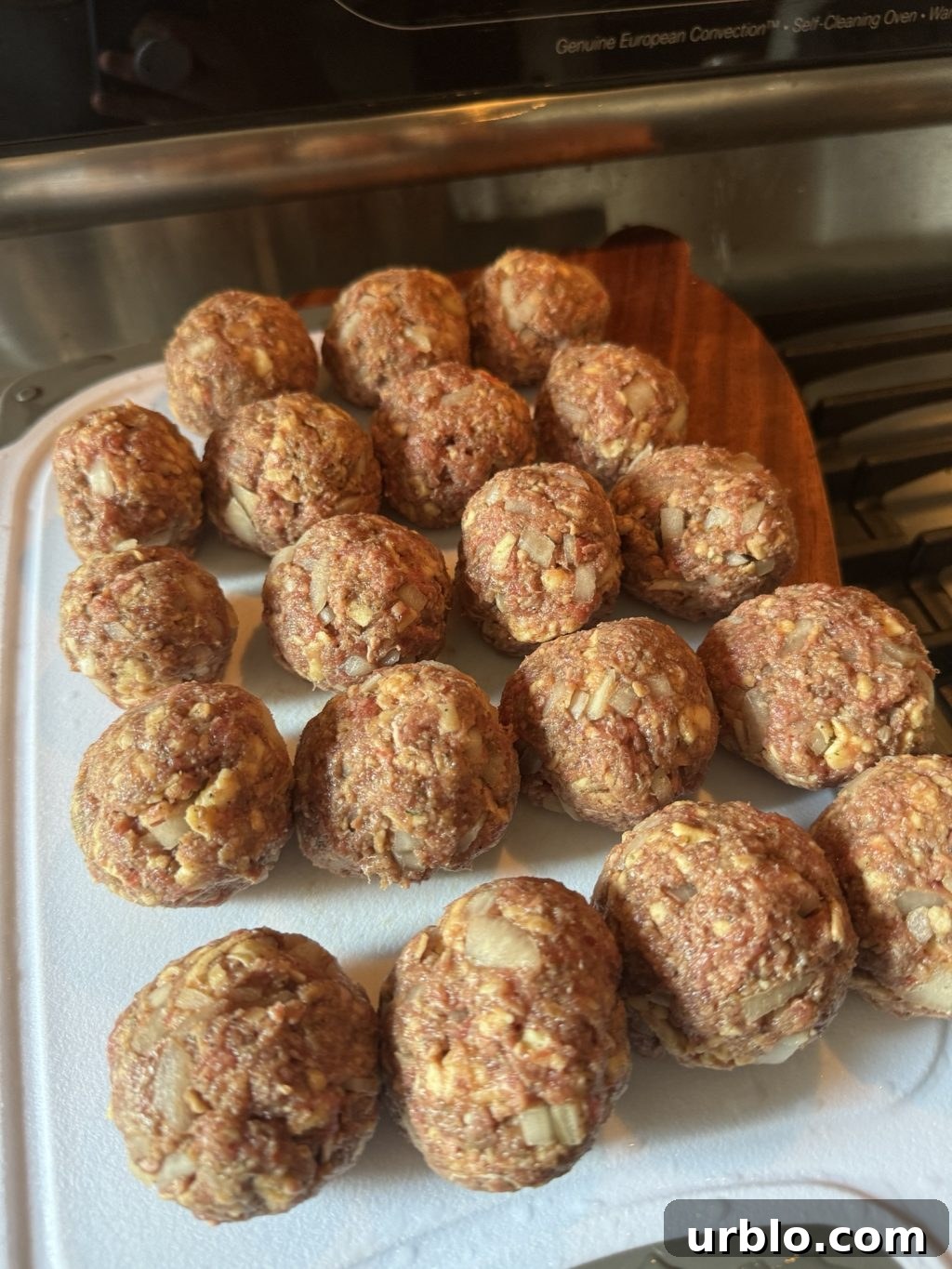 Uncooked, rolled meatballs.