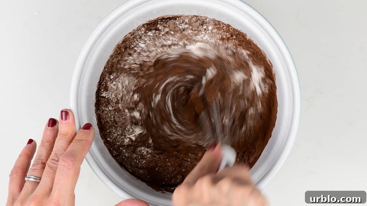 Pouring batter into mini tins