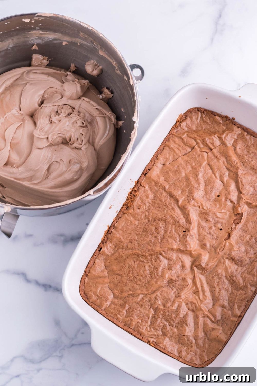 brownies baked in pan with french silk pie mixturein a bowl on the side 