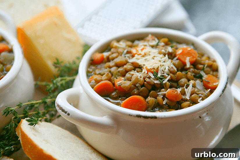 Lentil soup with grated cheese on top.