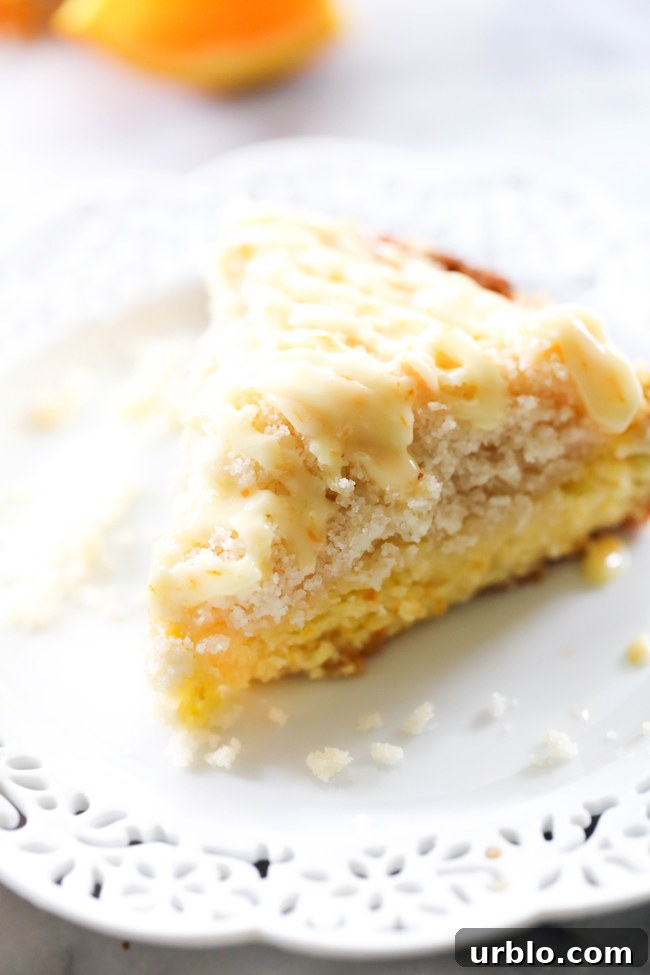 Orange Coffee Cake slice on a white plate.