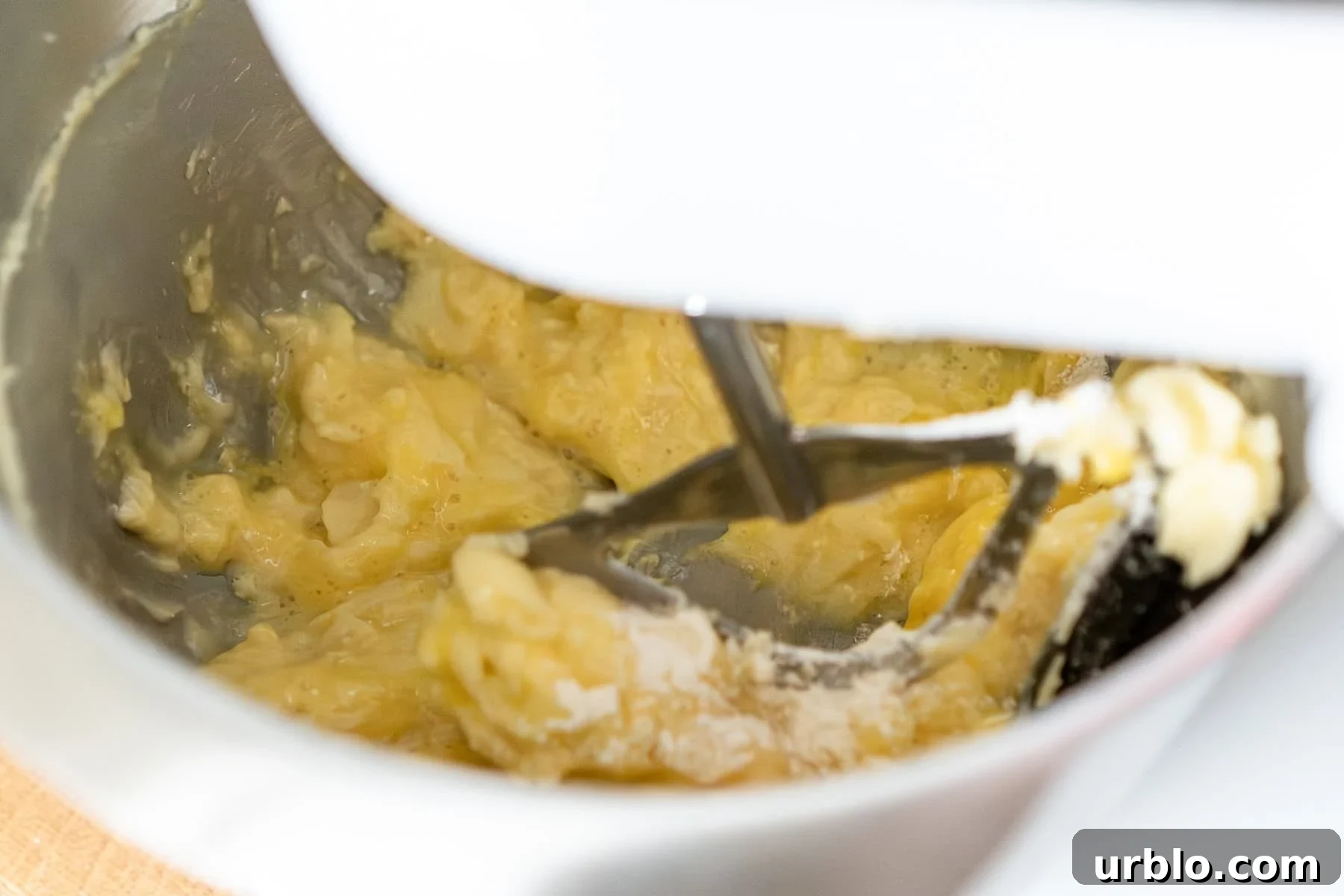 Fairy cake batter getting mixed with an electric mixer