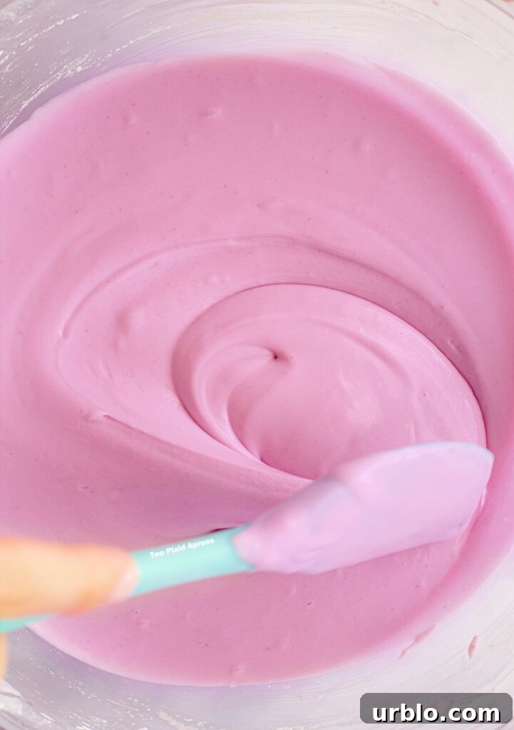 Showing the consistency of the ube mochi batter in a glass bowl.
