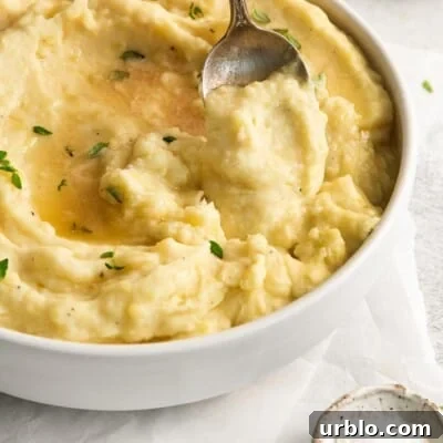 dairy-free potatoes in a serving bowl with a spoon