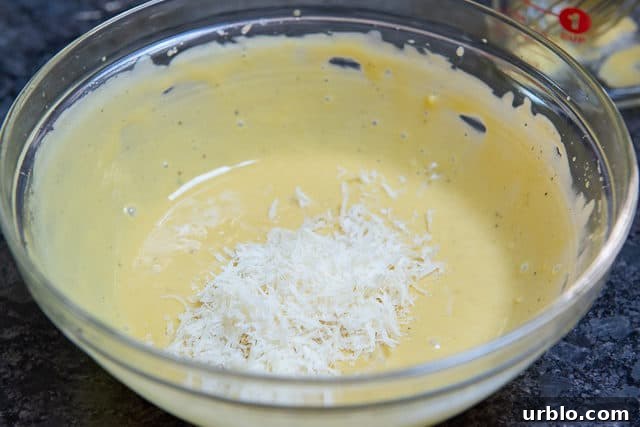 Grated Parmesan Cheese In Bowl of Dressing