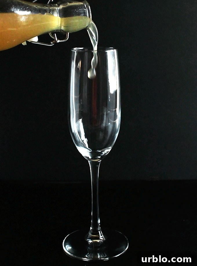 Pouring the pear syrup for the Pear Mimosa!