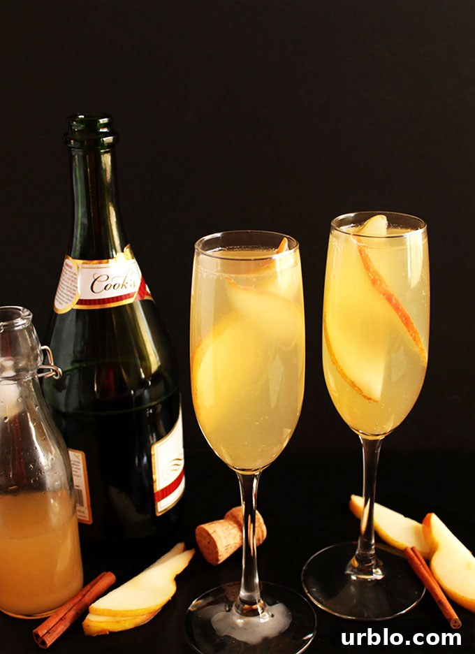 Pear Mimosa. So easy to make. Sweet pear with a hint of warming cinnamon, mixed with bubbly champagne! Perfect for any cocktail celebration party!