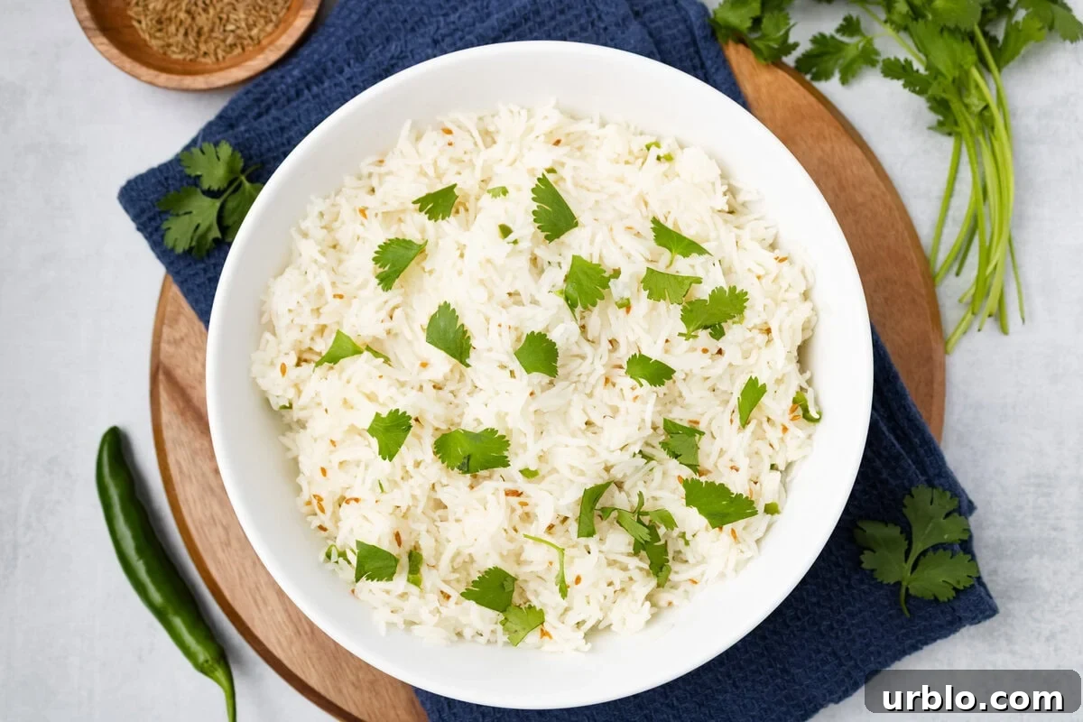 An overhead image of quick jeera rice in a serving bowl.
