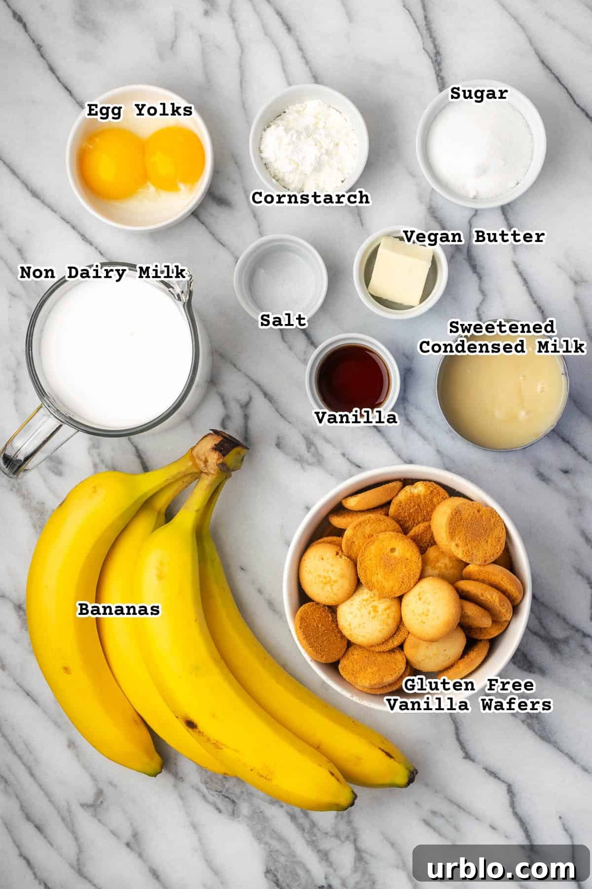 Ingredients for a gluten free and dairy free banana pudding sitting on a marble counter. 