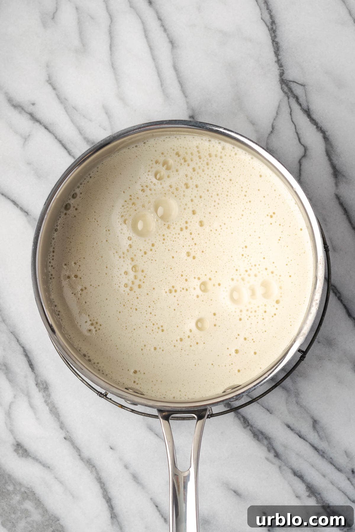Pudding mixture in a saucepan. 