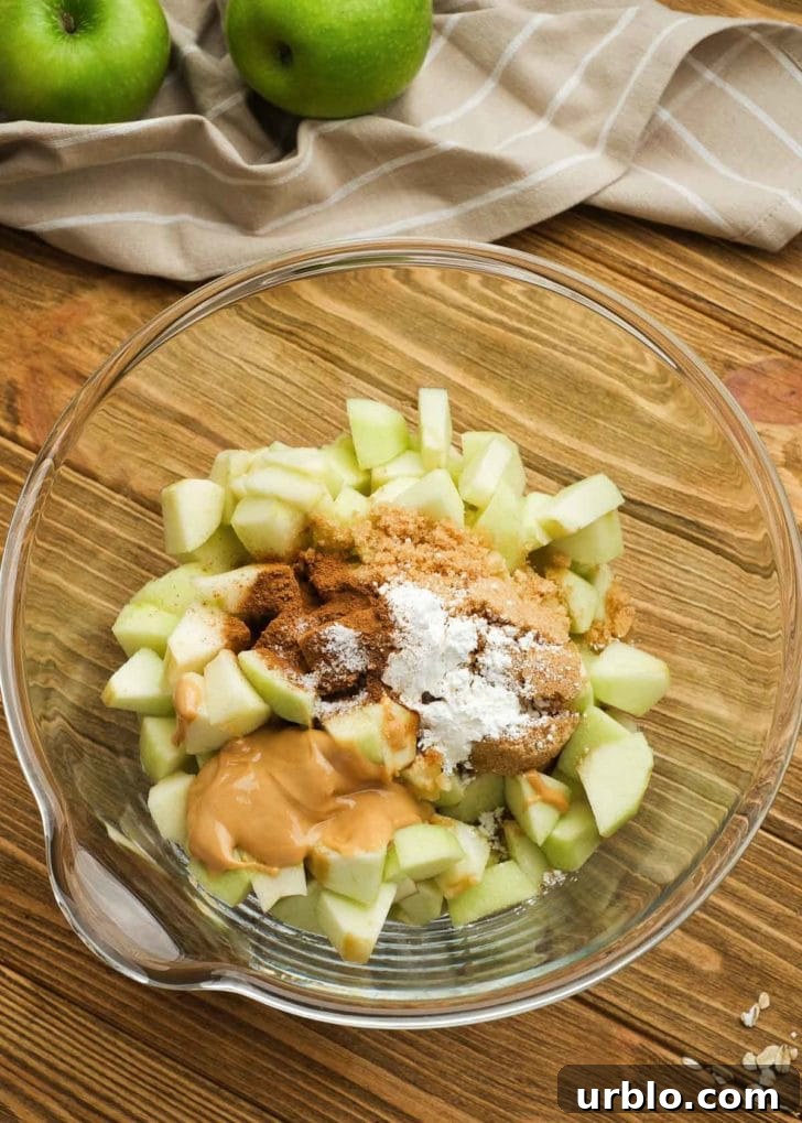 apple filling ingredients in a clear mixing bowl