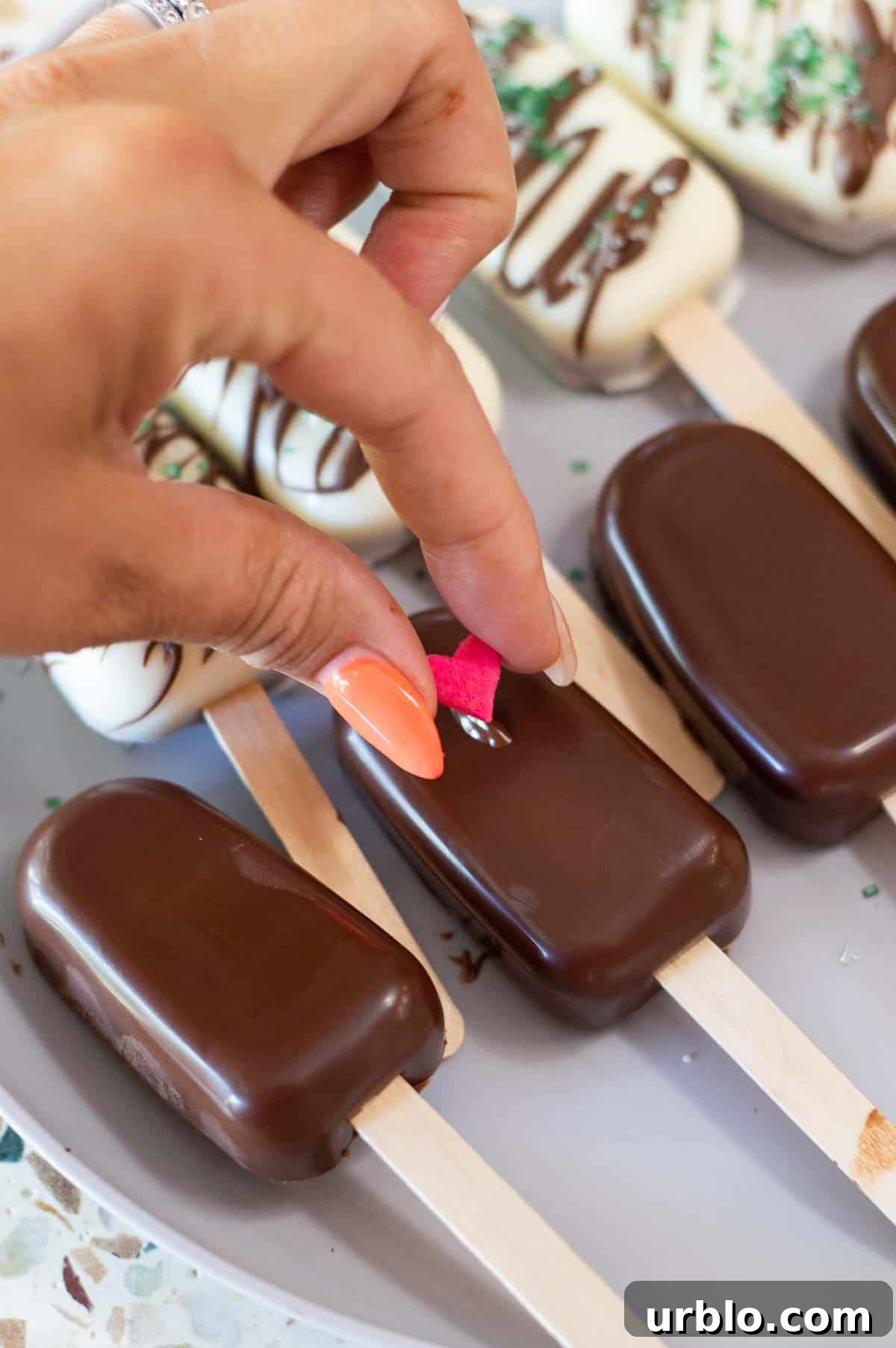 Cakesicles on a marble plate