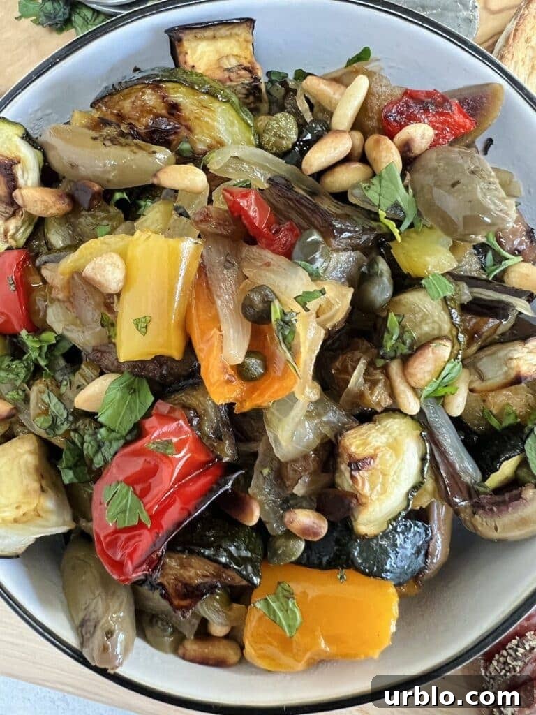 Overhead photo of roasted vegetable caponata in white bowl.