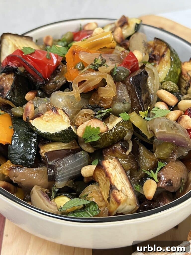 Photo of roasted vegetable caponata in white bowl.