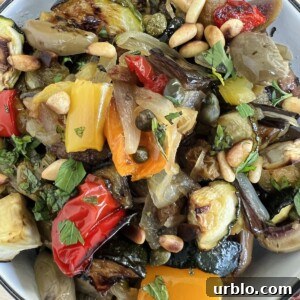 Overhead photo of roasted vegetable caponata in white bowl.