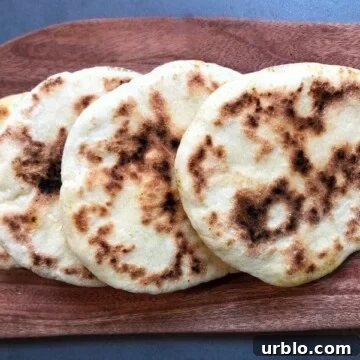 cooked pitas on board
