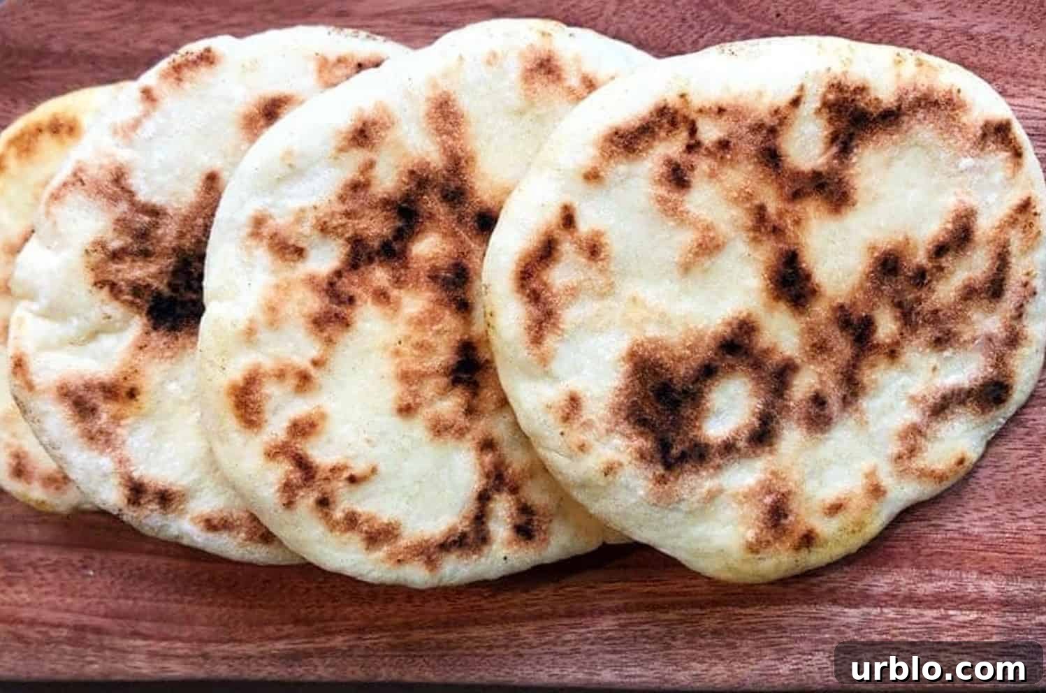 pita bread on a cutting board.