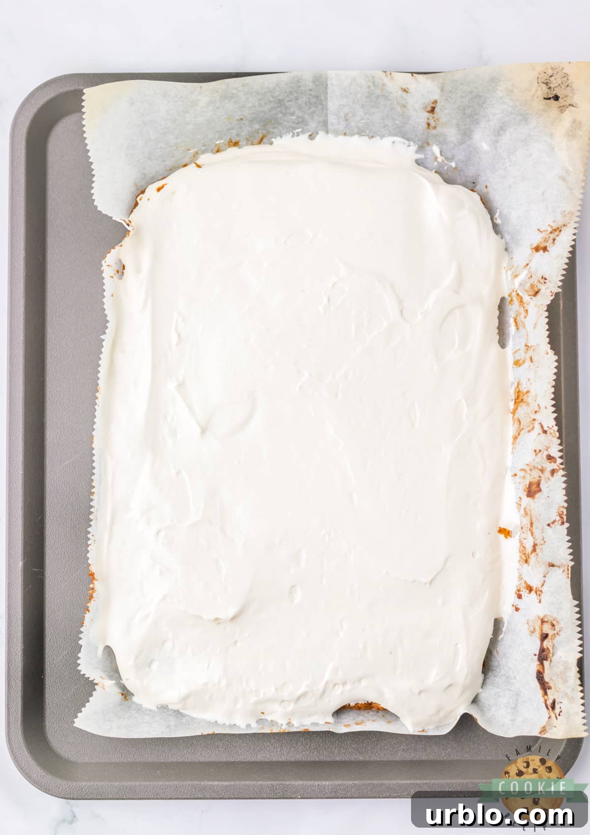 Spread the marshmallow filling over the cookie layer.