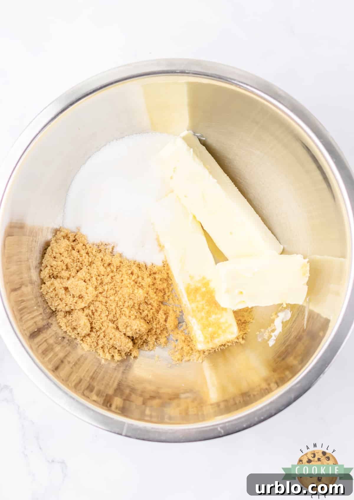 Creaming butter and sugars together.