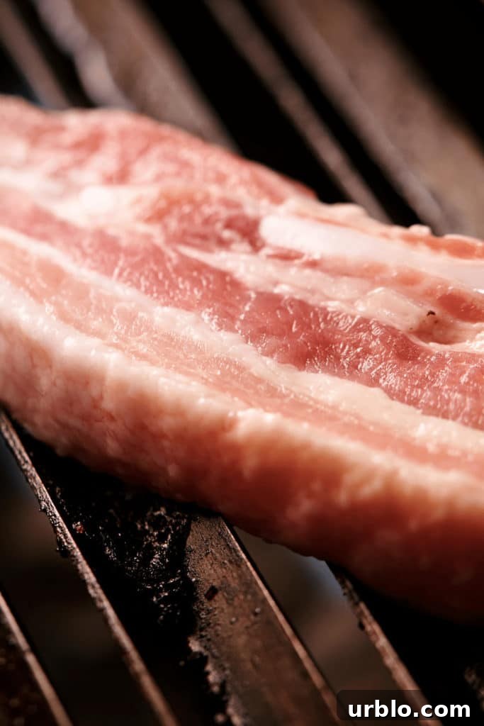 Heat each side of the pork belly