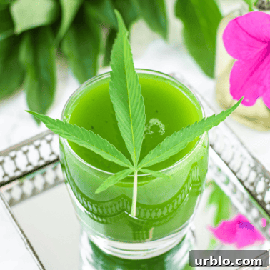 A picture of cannabis juice with a cannabis leaf on top.