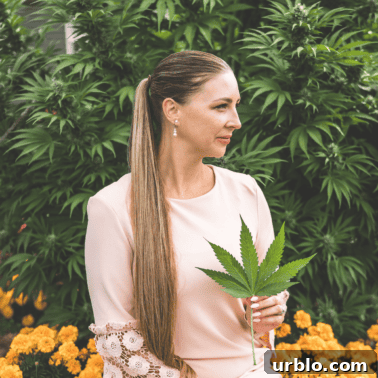 A picture of Emily Kyle holding a cannabis leaf.