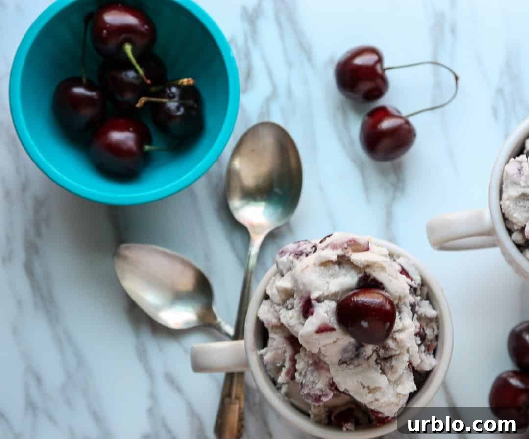 Homemade Cherry Amaretto Ice Cream Recipe 3 A bowl of cherries on a plate, with Ice cream