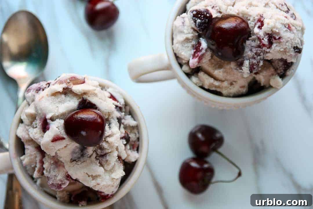 Homemade Cherry Amaretto Ice Cream Recipe 4 Two dishes of cherry amaretto ice cream with fresh cherries on top of each serving