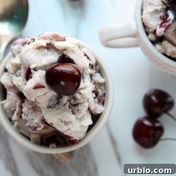A cherry dessert in a glass bowl, with Cherries