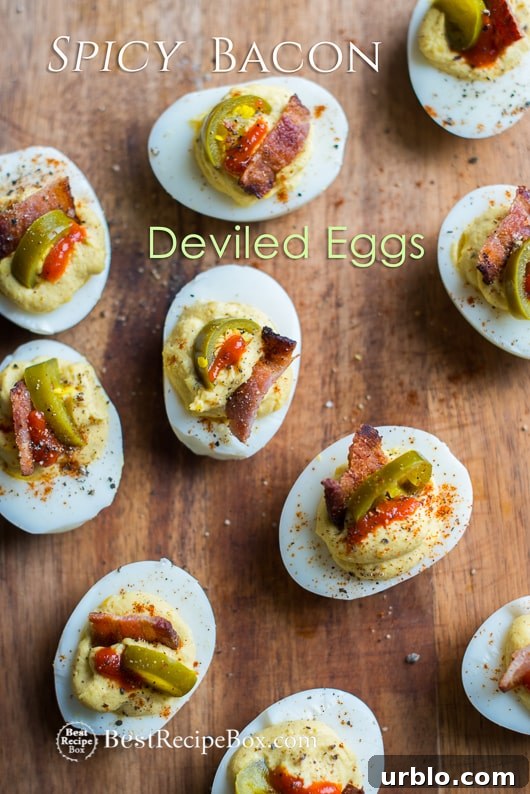 Deviled Eggs Recipe with Bacon, Sriracha, Jalapeño Spicy Deviled Eggs | @bestreciepbox Deviled Eggs Recipe with Bacon, Sriracha, Jalapeño Spicy Deviled Eggs on a cutting board