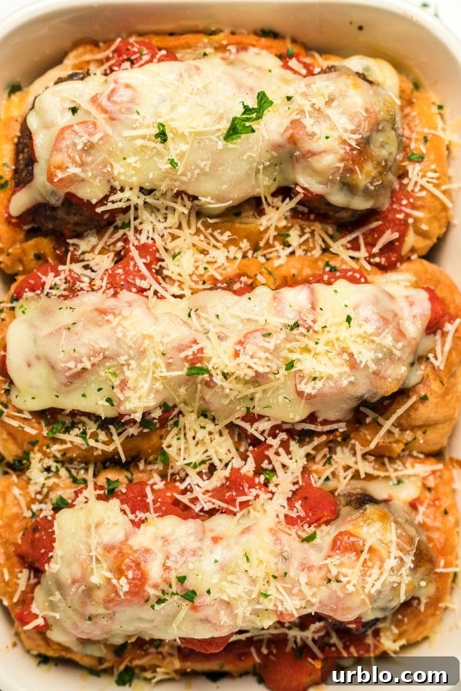 Baked meatball sandwich in a white baking dish.