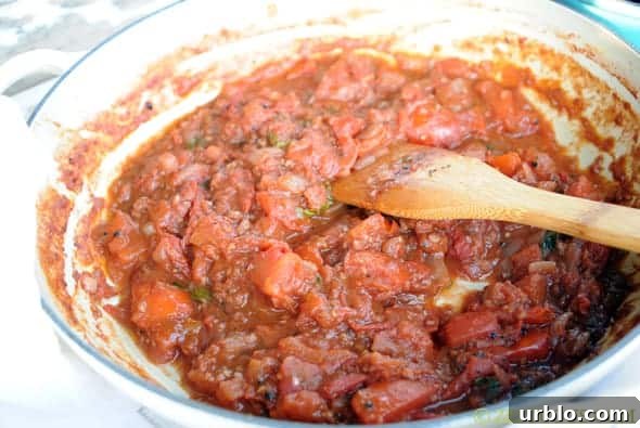 tomato sauce simmering in a pan