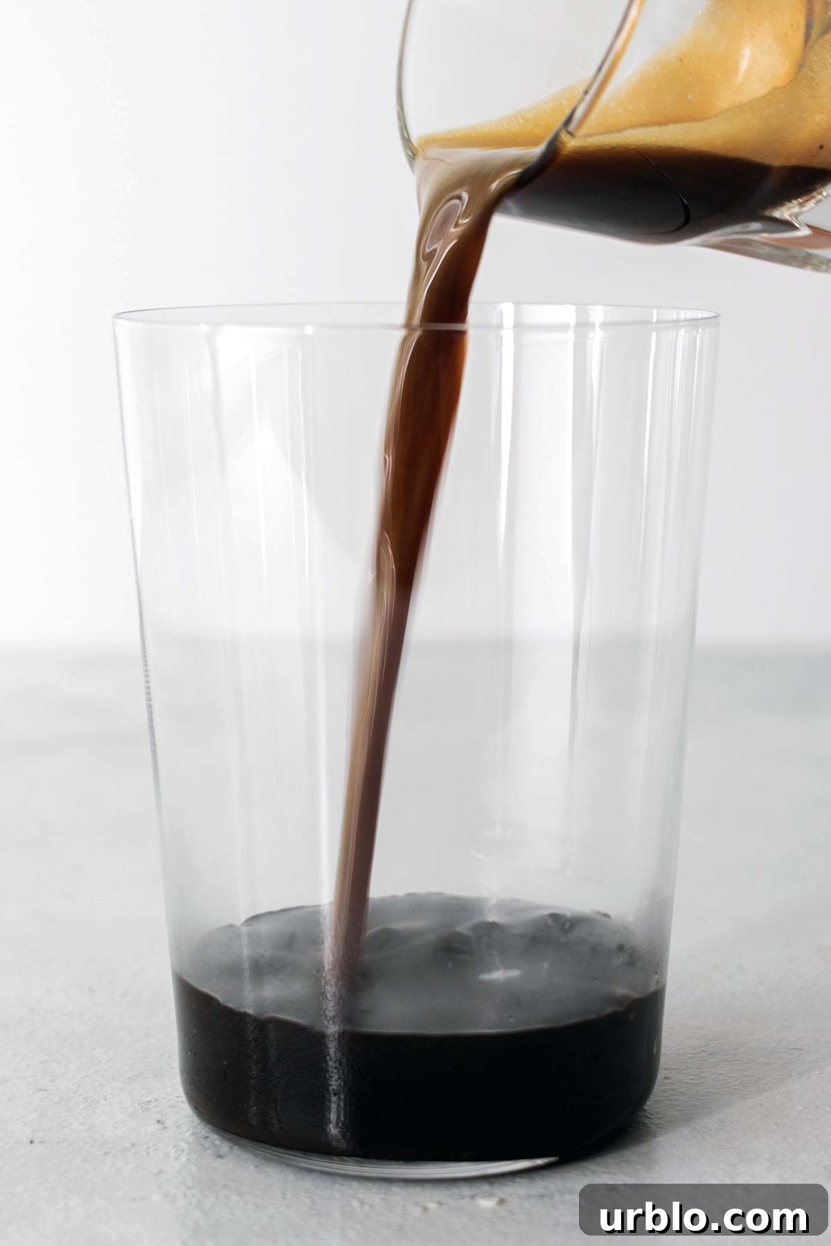 Pouring espresso into a cup.