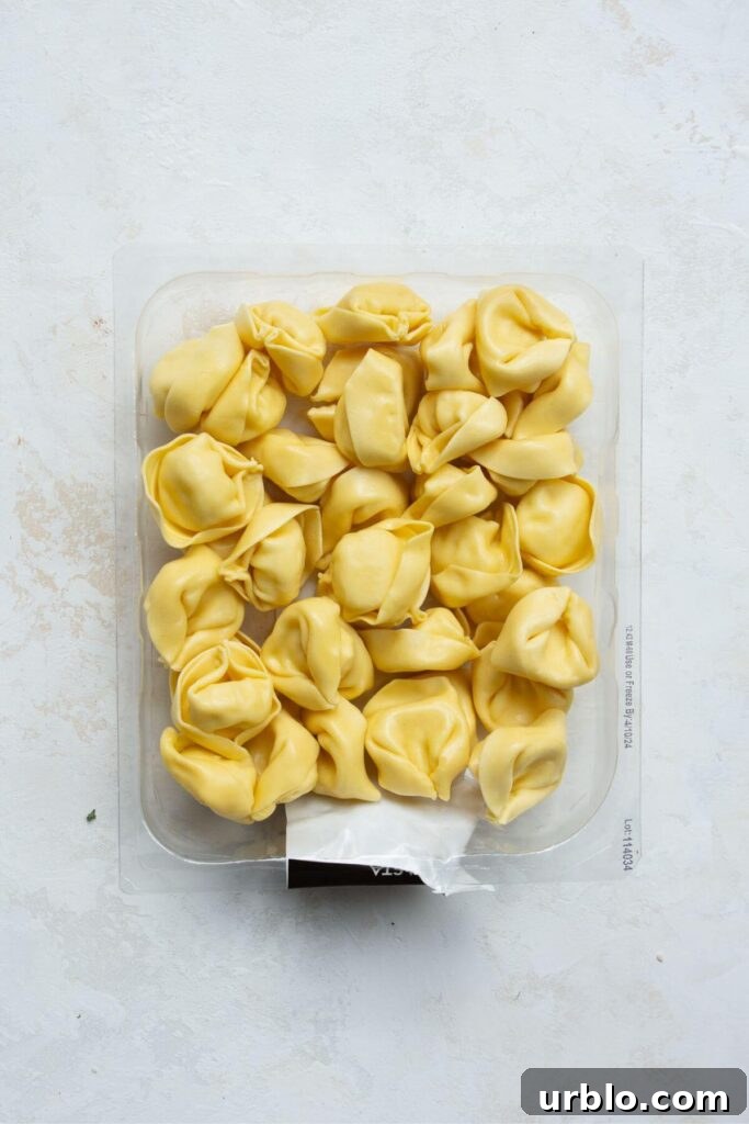 fresh cheese tortellini in it's box before cooking to show the correct type of tortellini to use for this soup