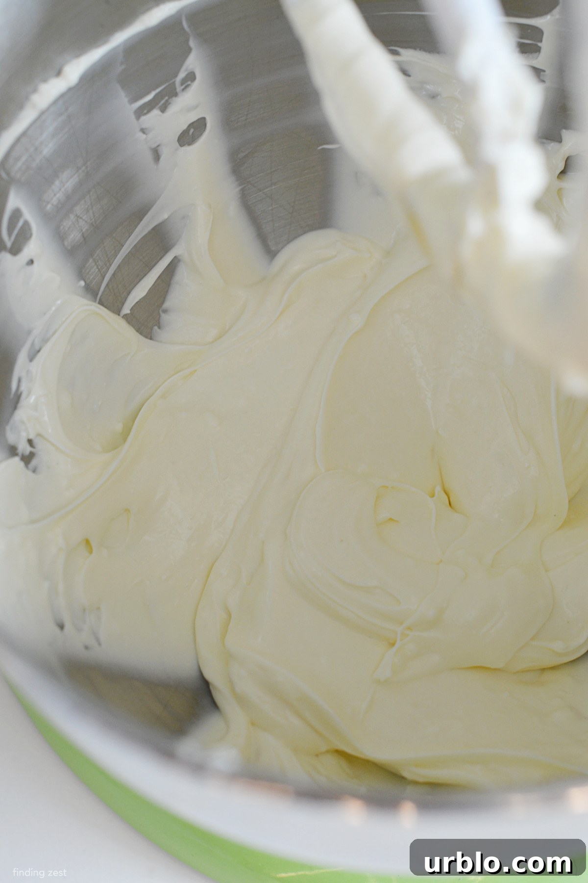 Mixing softened cream cheese and mayo for a dip recipe