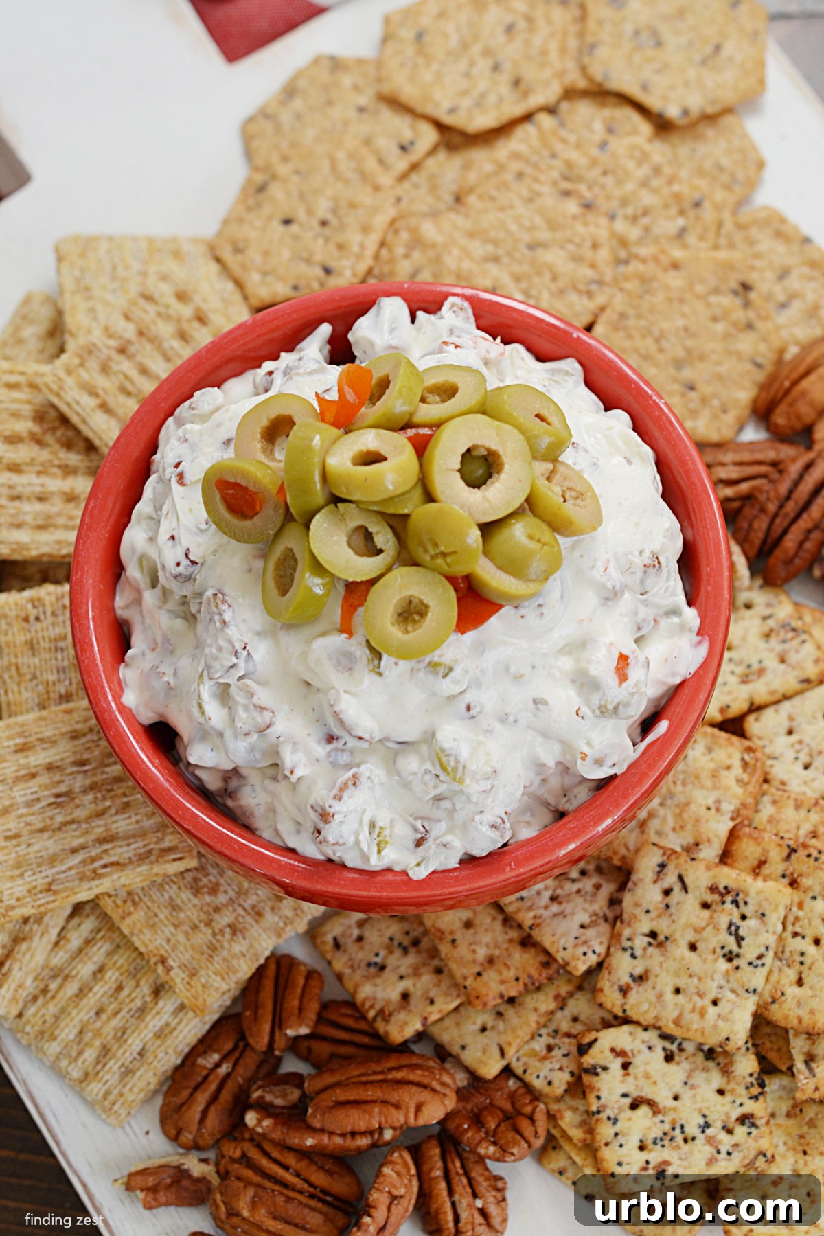 This cream cheese and olive spread is the perfect appetizer for your next holiday, party or game day celebration! Serve with your favorite crackers or bread.