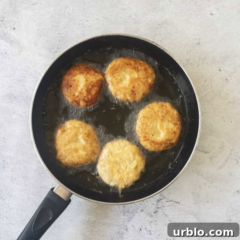 Crispy Potato Fritters Recipe for Golden, Crunchy Hash Browns 7 Fry the fritters in a skillet until golden and crispy.