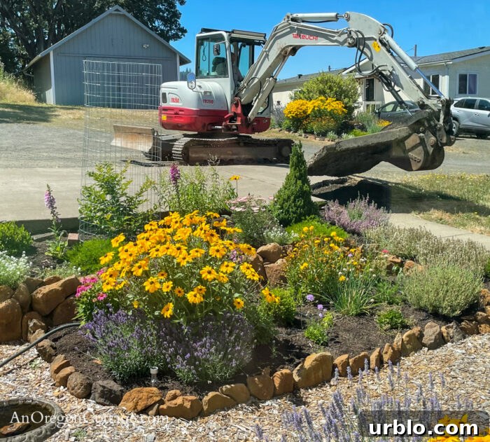 excavator removing farmhouse cement pad