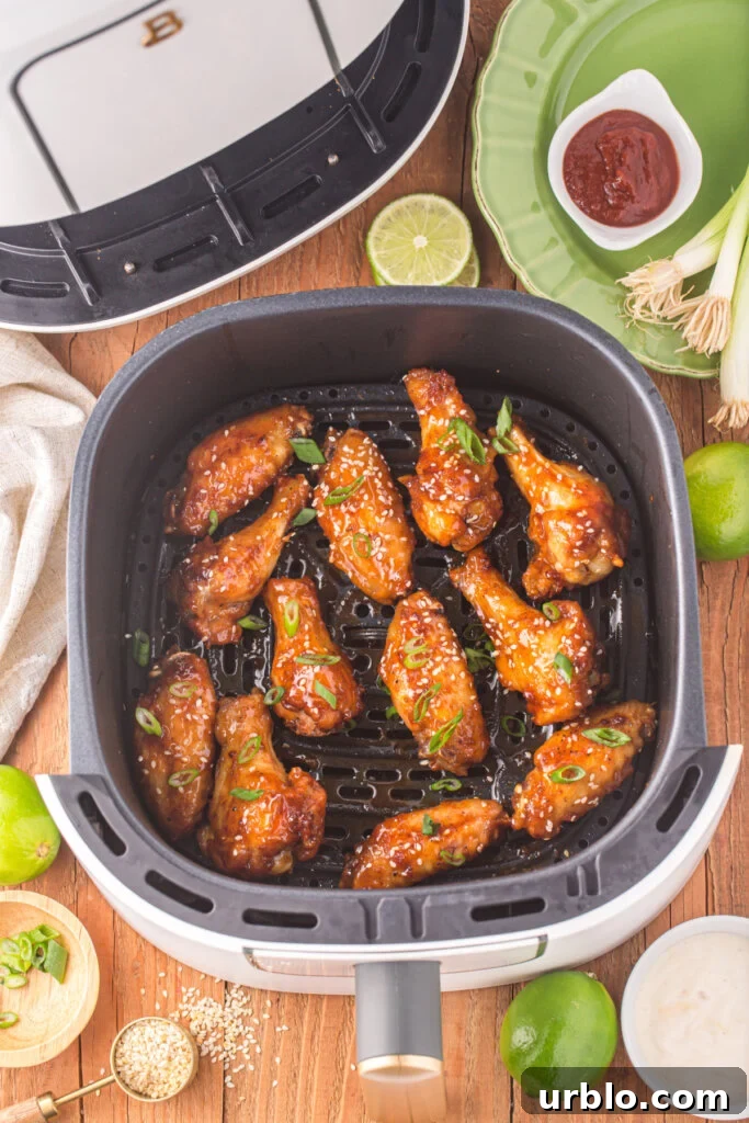 honey sriracha wings in air fryer basket