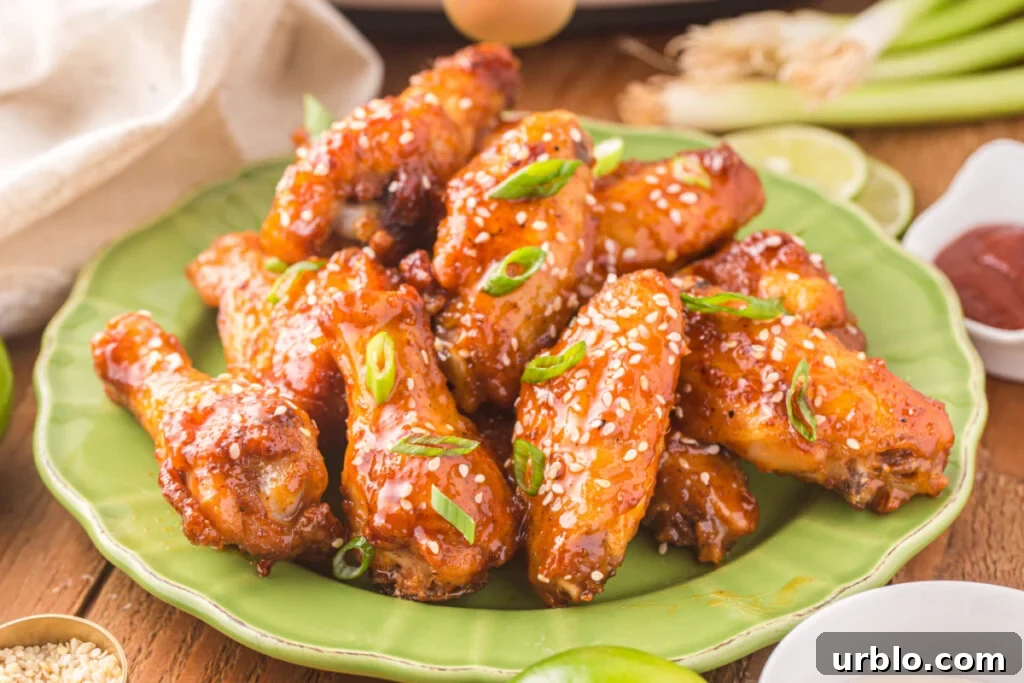 cooked honey sriracha wings on green plate