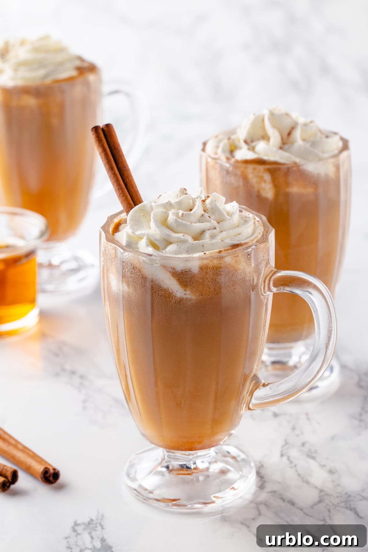 3 glass mugs of hot buttered rum