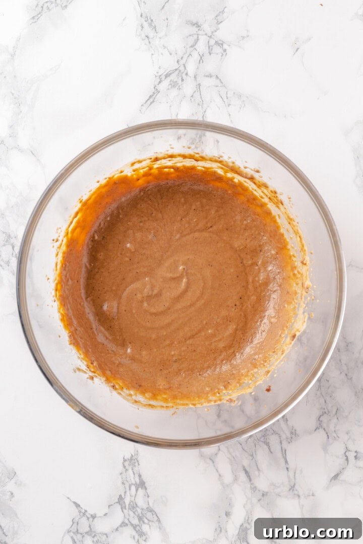 Overhead view of batter for hot buttered rum in mixing bowl