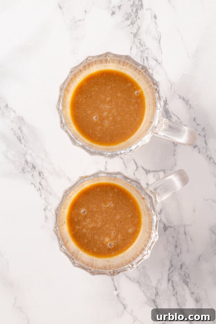 Overhead view of rum and batter in glass mugs
