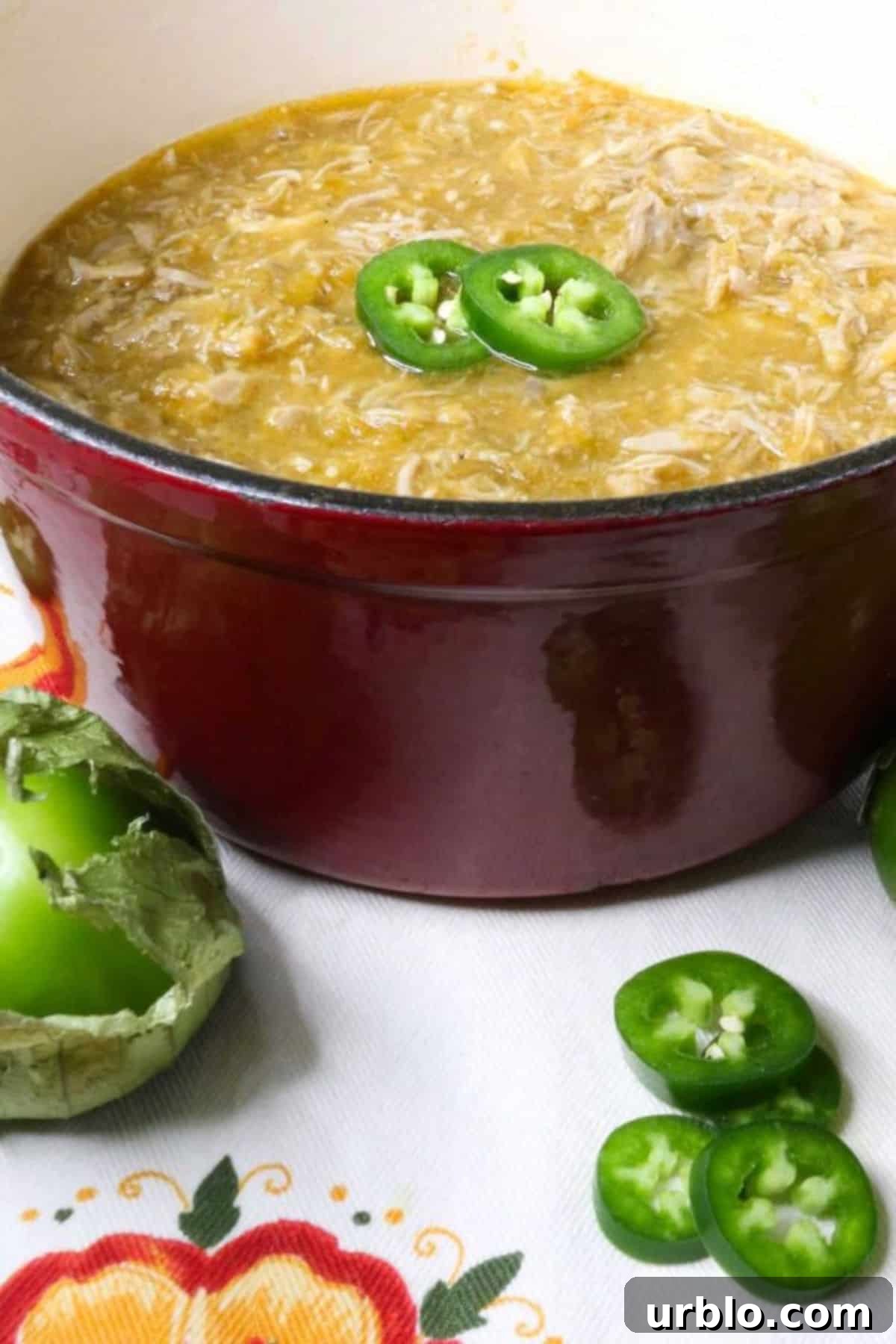 Salsa Verde Pulled Pork in a small, red Dutch oven