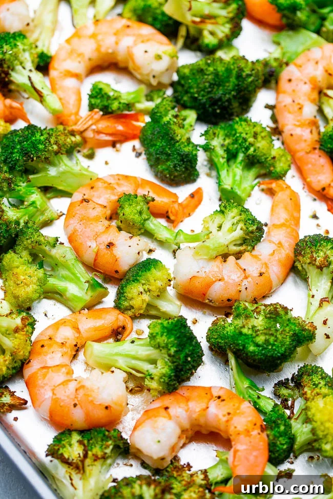 lemon butter baked shrimp and broccoli on a sheet pan