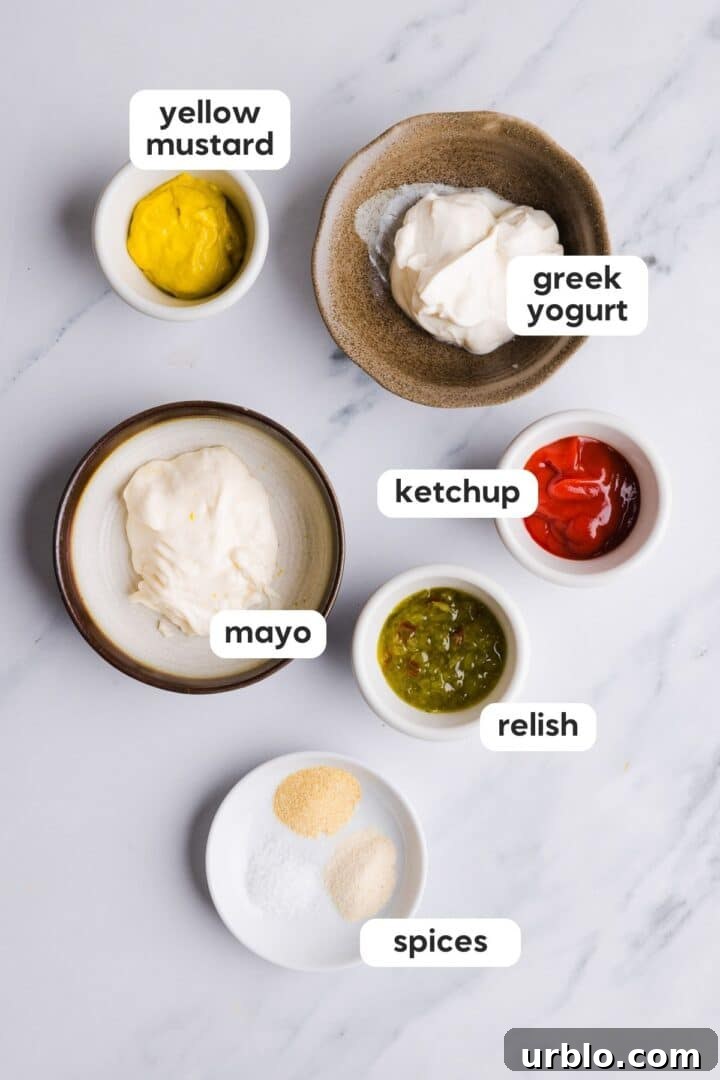 labeled overhead photo of ingredients for a healthy burger sauce, displayed in small bowls on a white counter