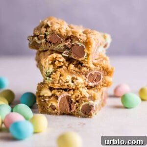 These Easter Mini Egg cookie bars are a fun and decadent way to eat your Cadbury Mini Eggs. They're soft, melty, and totally addictive.