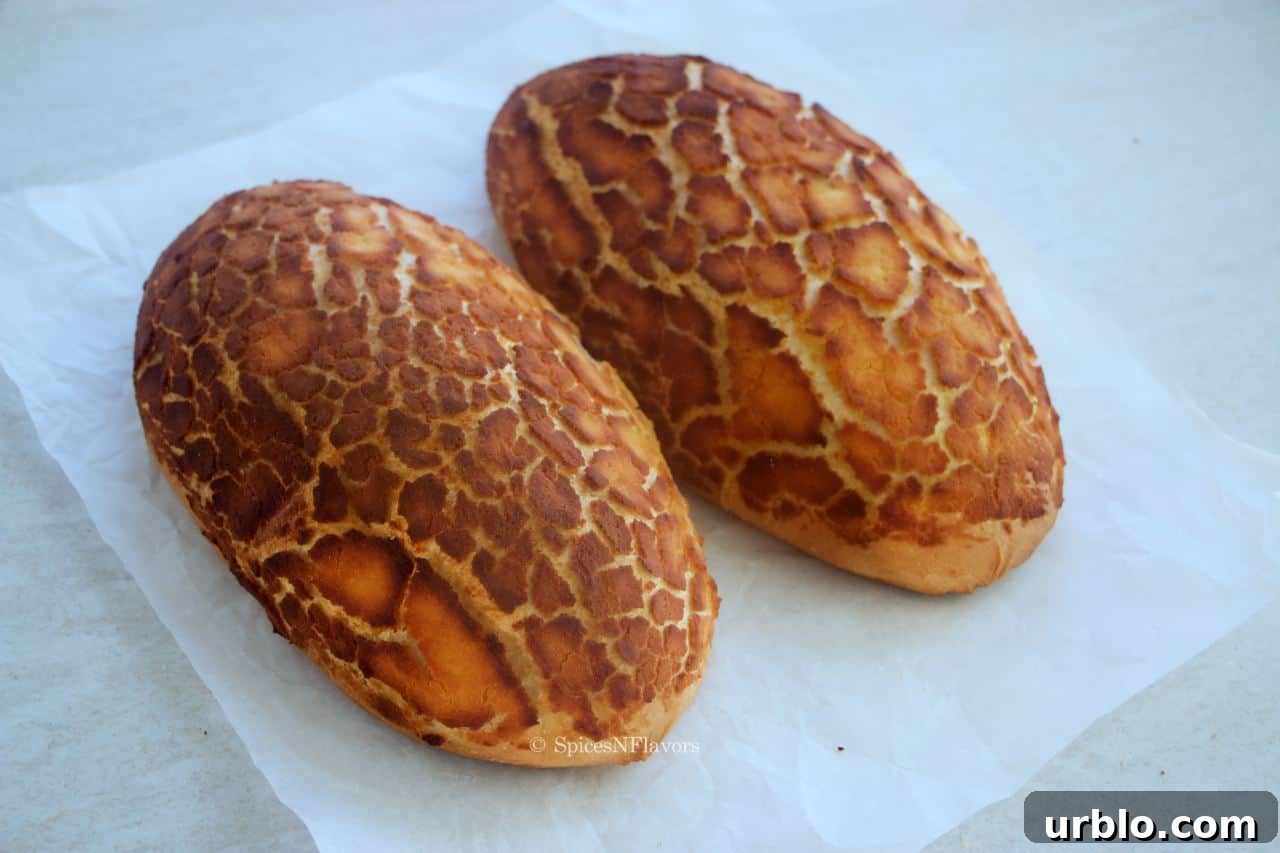 tiger bread rolls placed on a white parchment paper