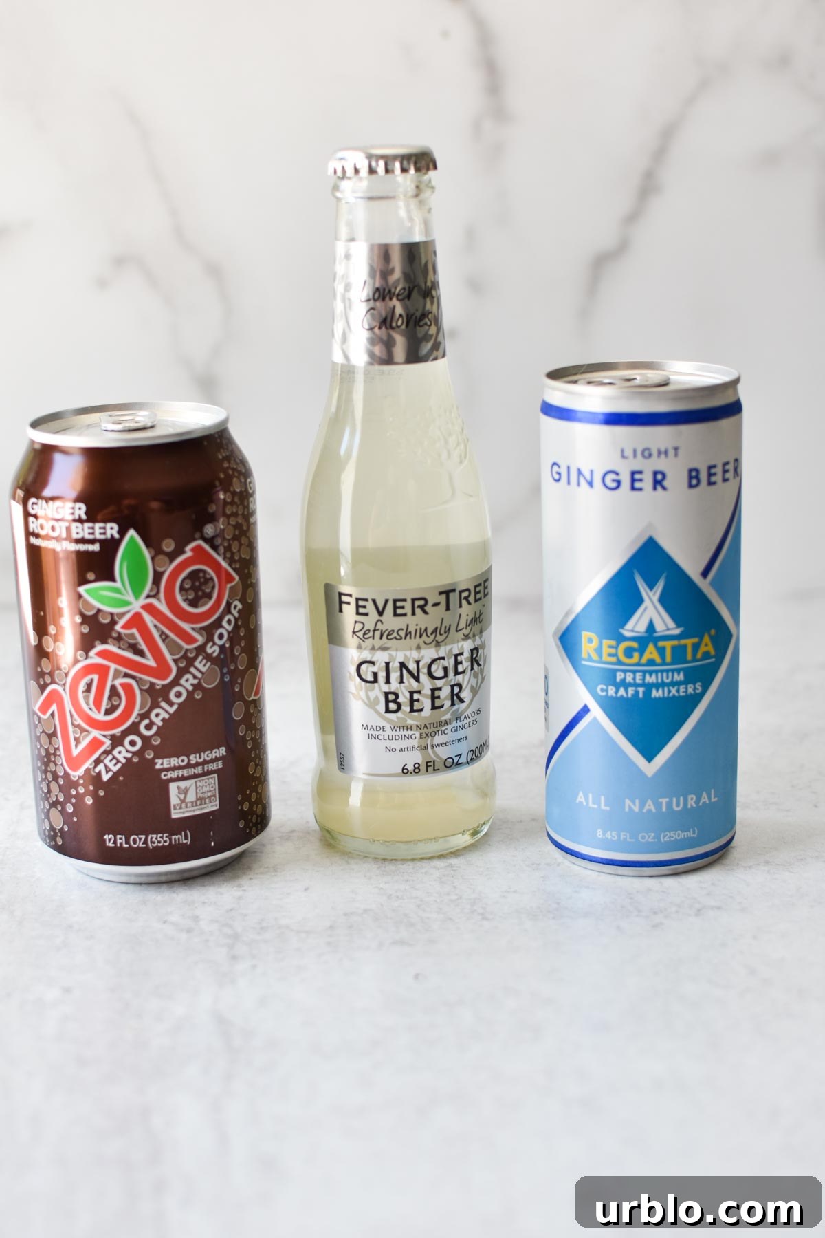 A bunch of ginger beers on a marble table