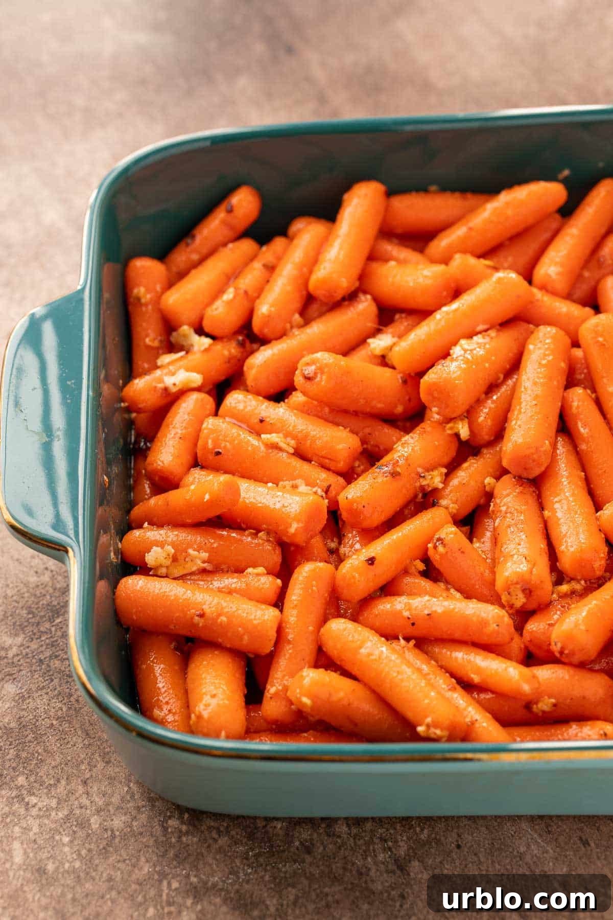 Spicy Honey-Glazed Carrots with Brown Butter and Herbs 4 Carrots in a baking dish ready to roast.